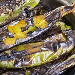 The best way to enjoy Hatch during the season is to char plenty of green chiles on a hot grill, peel them, remove seeds and veins, and store refrigerated in a closed container. Once done, making dishes with Hatch is quick and easy, taking just minutes. Prep more Hatch on a weekend and eat Hatch dishes all week long! Don’t have a grill? Buy them roasted at Central Market, HEB, or Whole Foods. They are more expensive and difficult to peel, though. Last year Central Market sold them roasted and peeled — even more expensive. If you have a gas stove, you can char peppers on the open flame. But only 1 or 2 at a time. But your kitchen will be filled with an amazing fragrance!