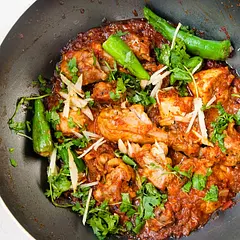 Delicious chicken Karahi.
firs boil your chicken. then add oil in pan and fried it. also put some ingredients red chilli etc and wait for 20 minutes. your chicken kahrahi is now ready. enjoy it