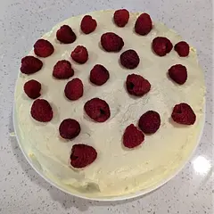 My 4yo son requested a "lemon cake with raspberries on the top" for his birthday today, and this is the recipe I used.  I added some yellow food coloring and decreased the powdered sugar in the frosting by a cup.  Excited to try a piece this evening!