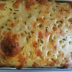 I've tried a few different focaccia recipes recently and this one is the best. The little bit of stretch and fold and longer rise makes for great bubbles/texture. Next time I'll try baking a little longer to ensure a crisp bottom.