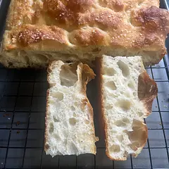 This is a once if not twice a week staple in my house now. Regular loaves are great to eat as is or use for sandwiches. I like to spice mine up by putting garlic confit and cherry tomatoes 