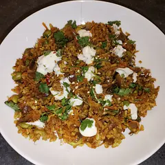 Added sultanas for sweetness. Needed more seasoning than recipe states. Can sub other nuts, and precook 160g dry rice instead of packet 
