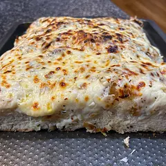 Bread really good, fluffy. After baking, topped with shredded Mozz cheese and melted garlic butter, then broiled. Super super delicious
