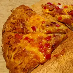 The recipe is for one big pizza. That wasn't very clear to me. I added dried oregano next to the garlic. I also substituted a small part of the flour with Whole-wheat (since I read a few times there was too much water anyway) and that was fine. 