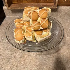 I love this recipe. What is the drizzle on top made of? I used condensed milk. 

Note: Use parchment paper in your pan when baking the crust. 
Sit overnight in the freezer for best results!!!