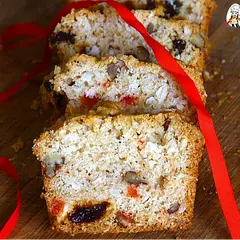 Add Caribbean warmth to your holidays with this Trinidad Sweet Bread! Packed with coconut, dried fruits, nuts, and the cozy flavors of cinnamon and nutmeg, it’s a quick bread twist on traditional fruitcake—no soaking required! Bake as mini loaves for gifting. Fresh coconut is ideal, but shredded works beautifully too.