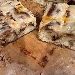 I wanted to have something sweet, but not too sweet and the cinnamon roll idea just hit the spot.  I did a drizzle with cream cheese.  Loved by all who tried it.Bad picture - great bread.