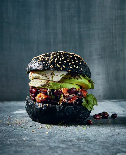 GRILLED AVOCADO BURGER with marinated beans and crème fraîche