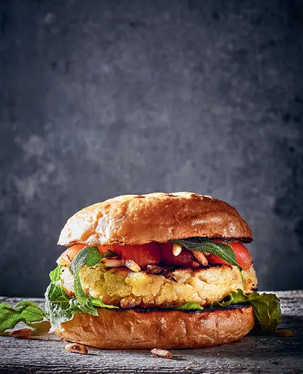WHITE BEAN BURGER with smoked tomatoes, deep-fried sage and roasted pine nuts