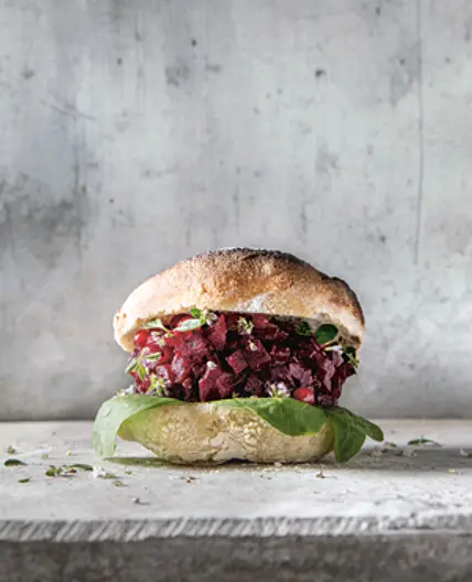 SALT-ROASTED BEETROOT BURGER WITH PICKLED REDCURRANTS AND SPINACH