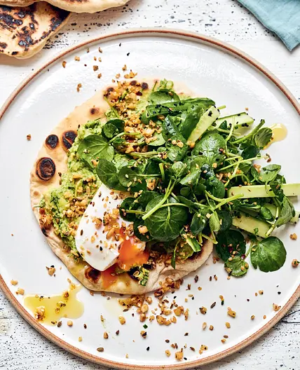 FLATBREADS WITH MASHED AVOCADO, POACHED EGGS, CHILLI, PRESERVED LEMON AND PINE NUTS