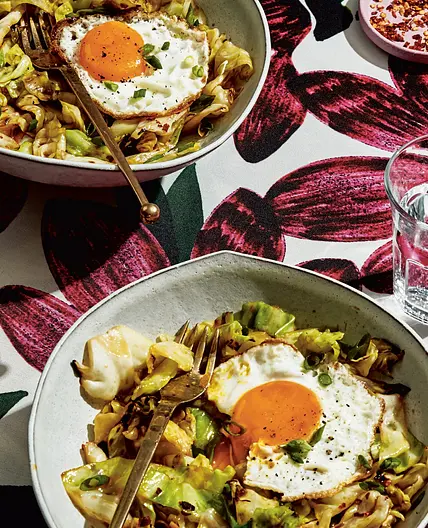 pad see ew cabbage with a runny egg