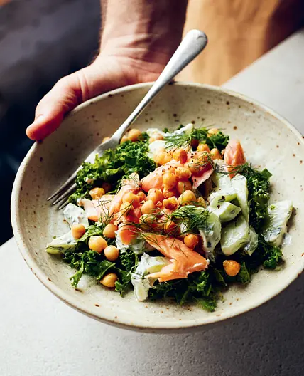 Chopped kale, dill and chickpea salad with smoked trout