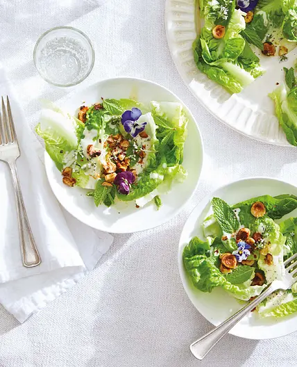 little gem with creamy dressing, hazelnuts, and petals