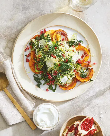 shredded kale and brussels with roasted squash and pomegranate
