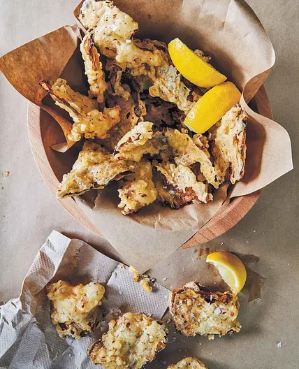 Battered and Fried Cabbage with Crispy Seeds and Lemon