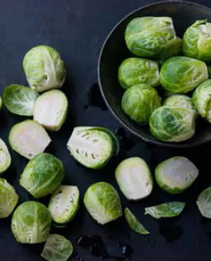 WARM BRUSSELS SPROUTS & KALE SALAD WITH BLUE CHEESE DRESSING