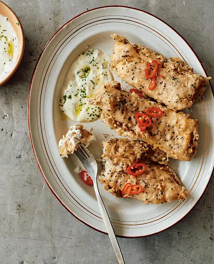 Buckwheat-battered fish with toum and pickled chiles