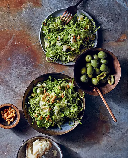 SHAVED BRUSSELS SPROUTS, PINE NUTS, AND GREEN OLIVES
