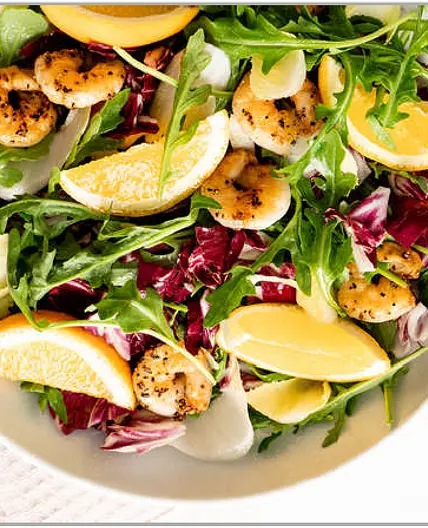 Grilled shrimp salad with oranges and mixed greens