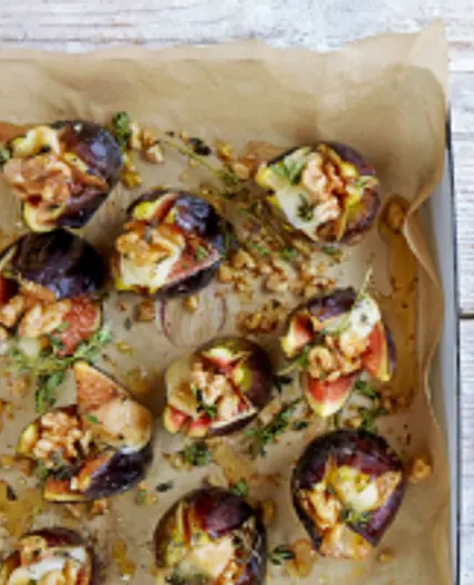 Split figs, stuffed with taleggio, walnuts, thyme & honey