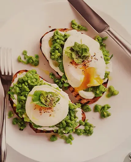 Smashed pea, goat's cheese and egg bruschetta