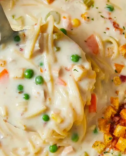 Creamy chicken noodle soup with mini croutons
