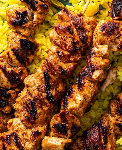 Chicken tikka skewers with rice