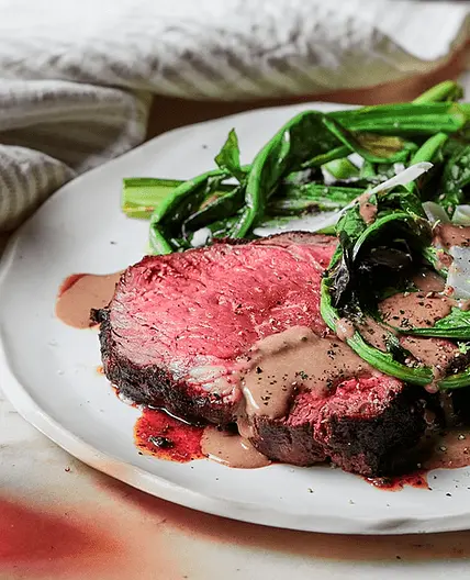 Charred porcini scotch fillet with bitter greens and black garlic bagna cauda sauce