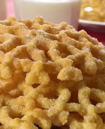 Buñuelos de viento espolvoreados