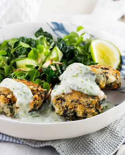 Potato and spinach cakes with almond parsley sauce