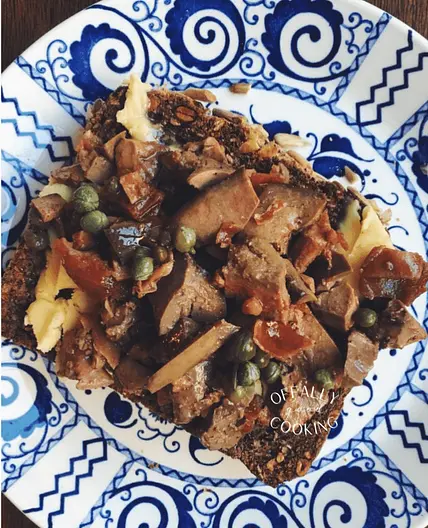 Duck liver and anchovies over buttered toast