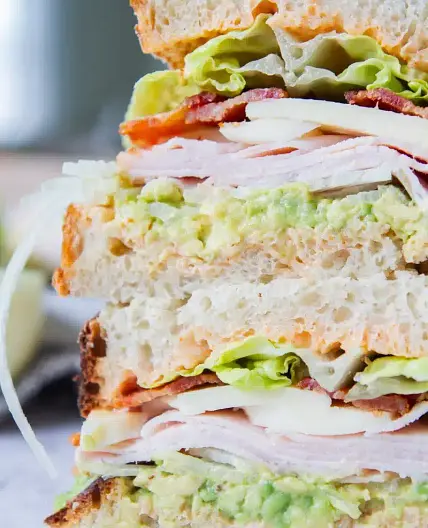 TURKEY AVOCADO CLUB SANDWICH