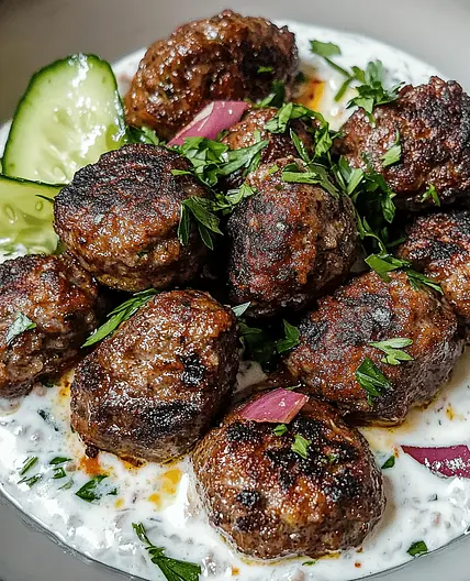 Spiced lamb kofta with cucumber raita & tabbouleh