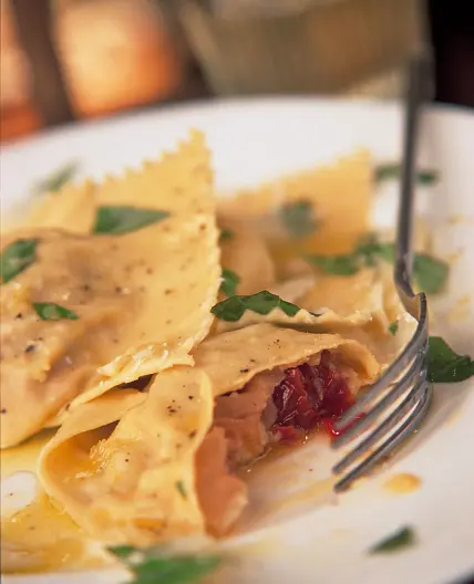 Ravioli with prosciutto, sun-dried tomatoes, basil & mozzarella