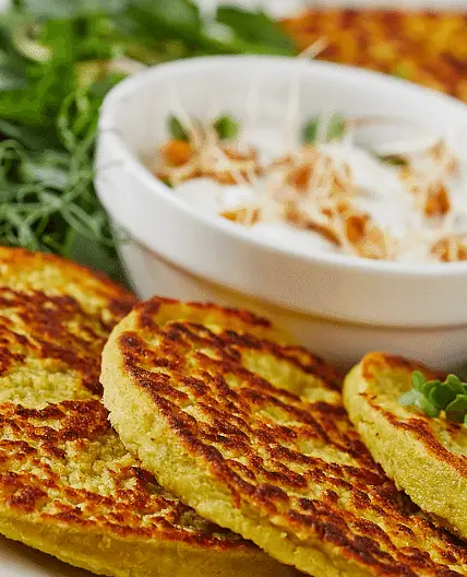 Breakfast: green pea pancake with whipped garlic butter