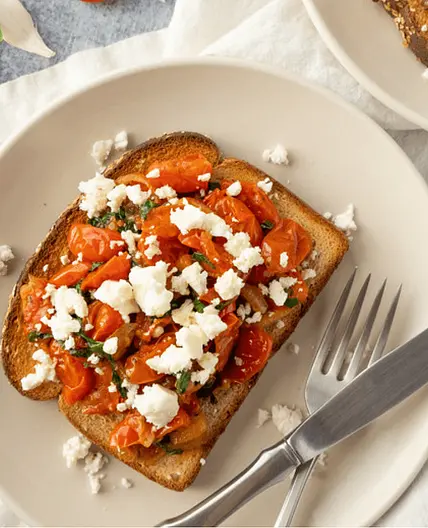 Pan-Fried Cherry Tomatoes with Basil & Feta over Toast