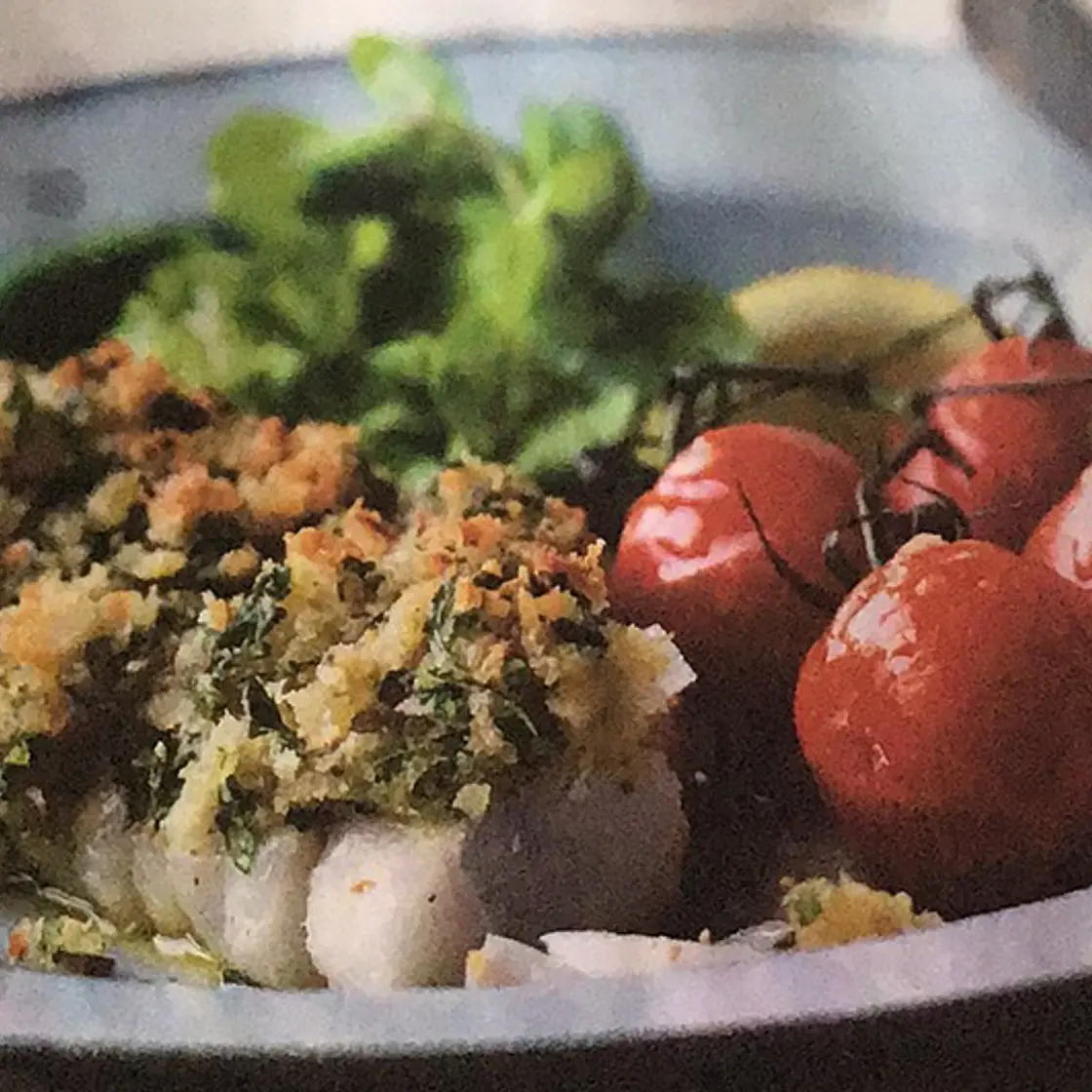 Crushed cod with grilled tomatoes