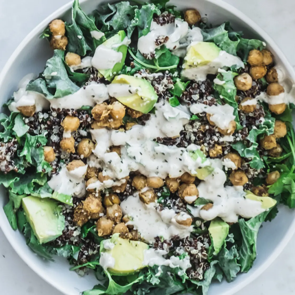 Kale quinoa bowl with spiced chickpeas
