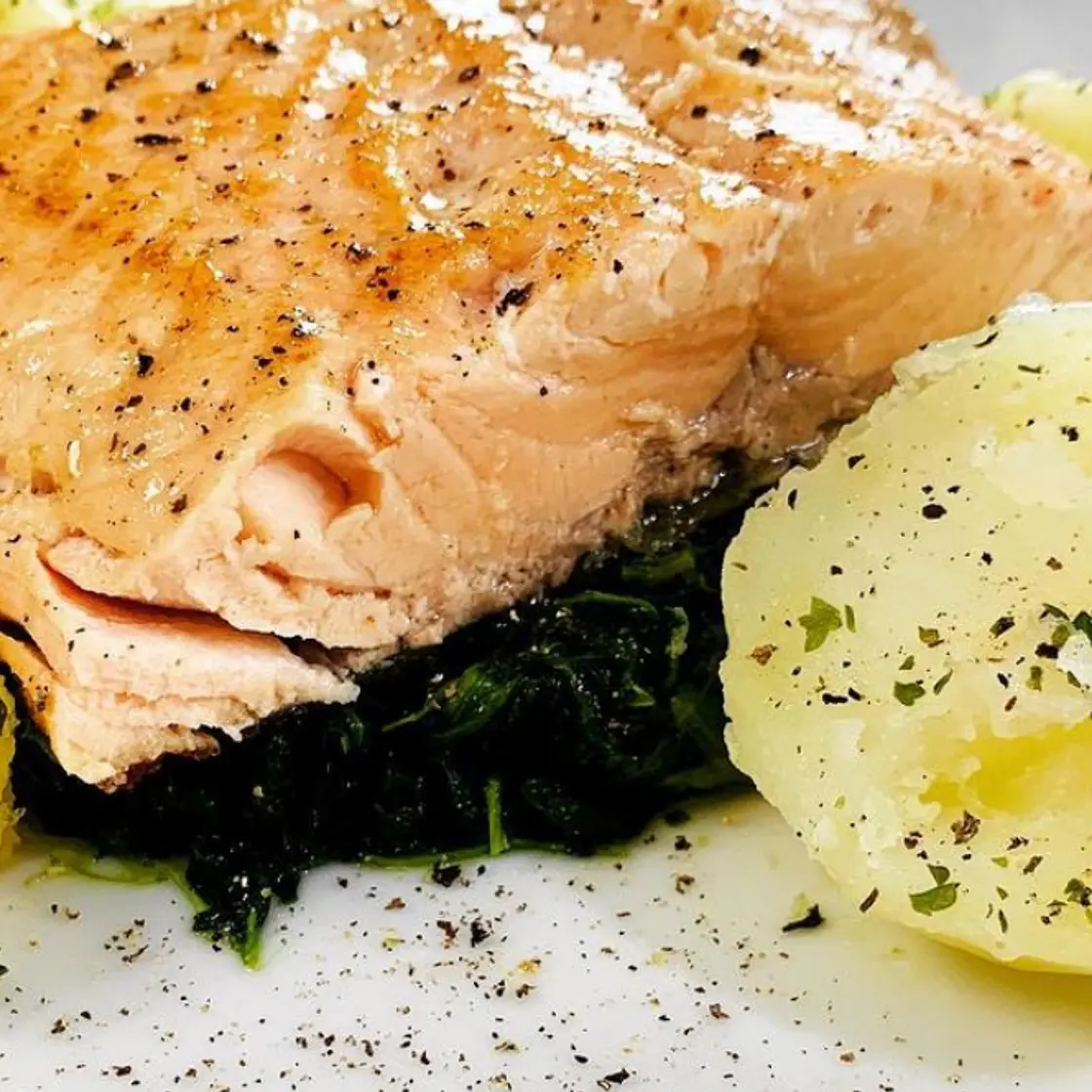 Salmon fillet on parsley potatoes and spinach
