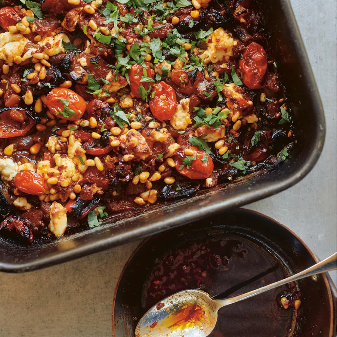 Charred tomatoes, onions and peppers with feta and harissa pine nuts