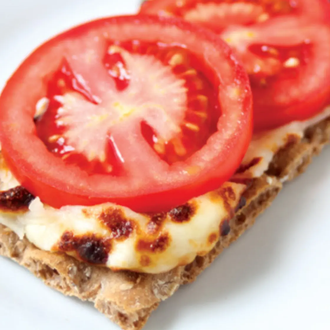 Tomato Cheese melt on a cracker