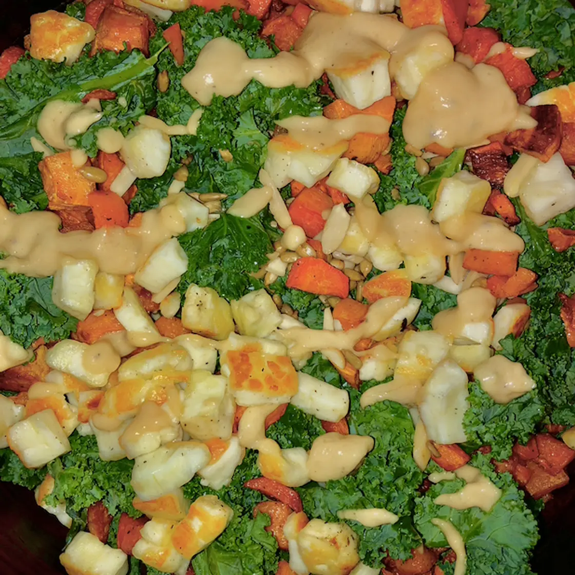 Fall kale salad with roasted vegetables and halloumi