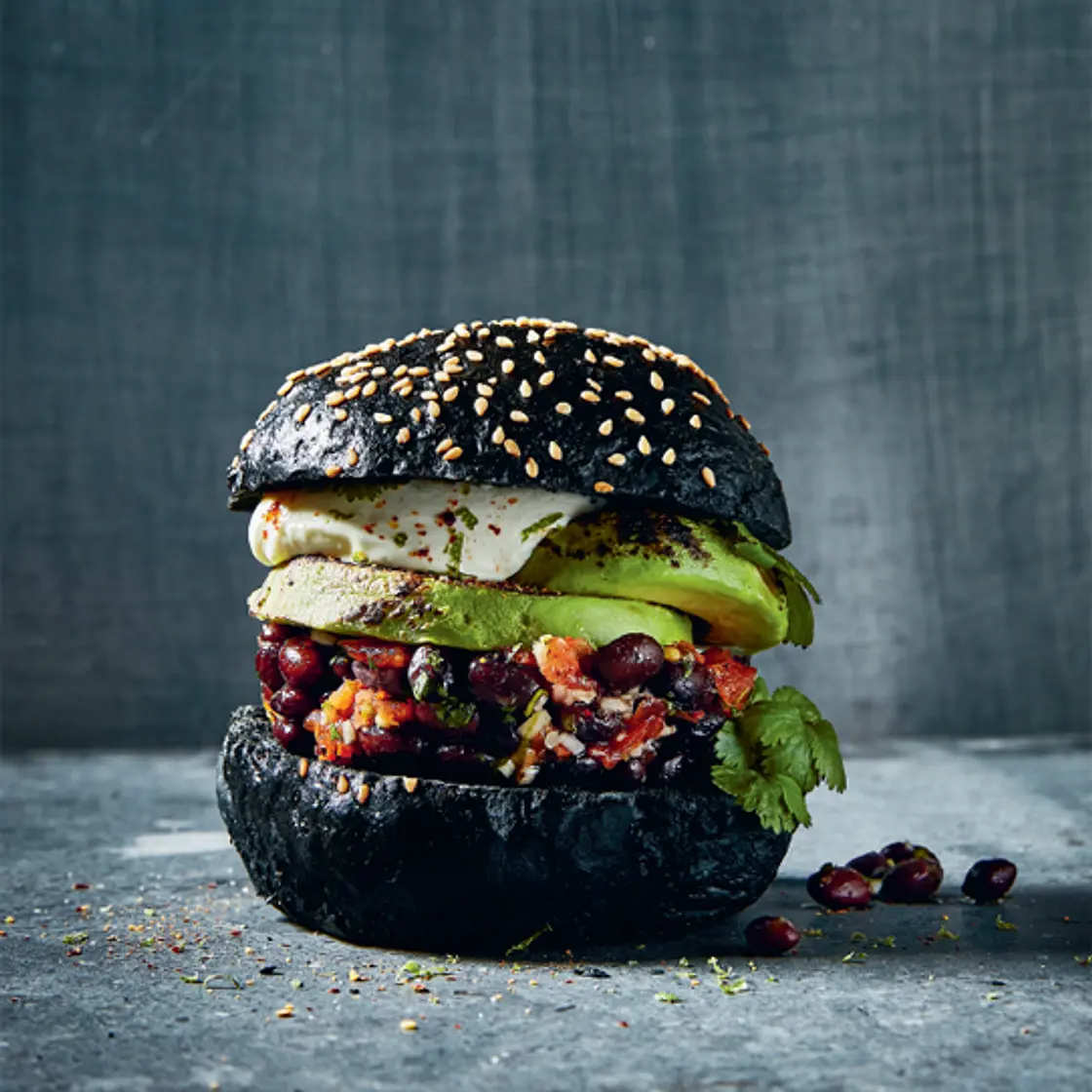 GRILLED AVOCADO BURGER with marinated beans and crème fraîche