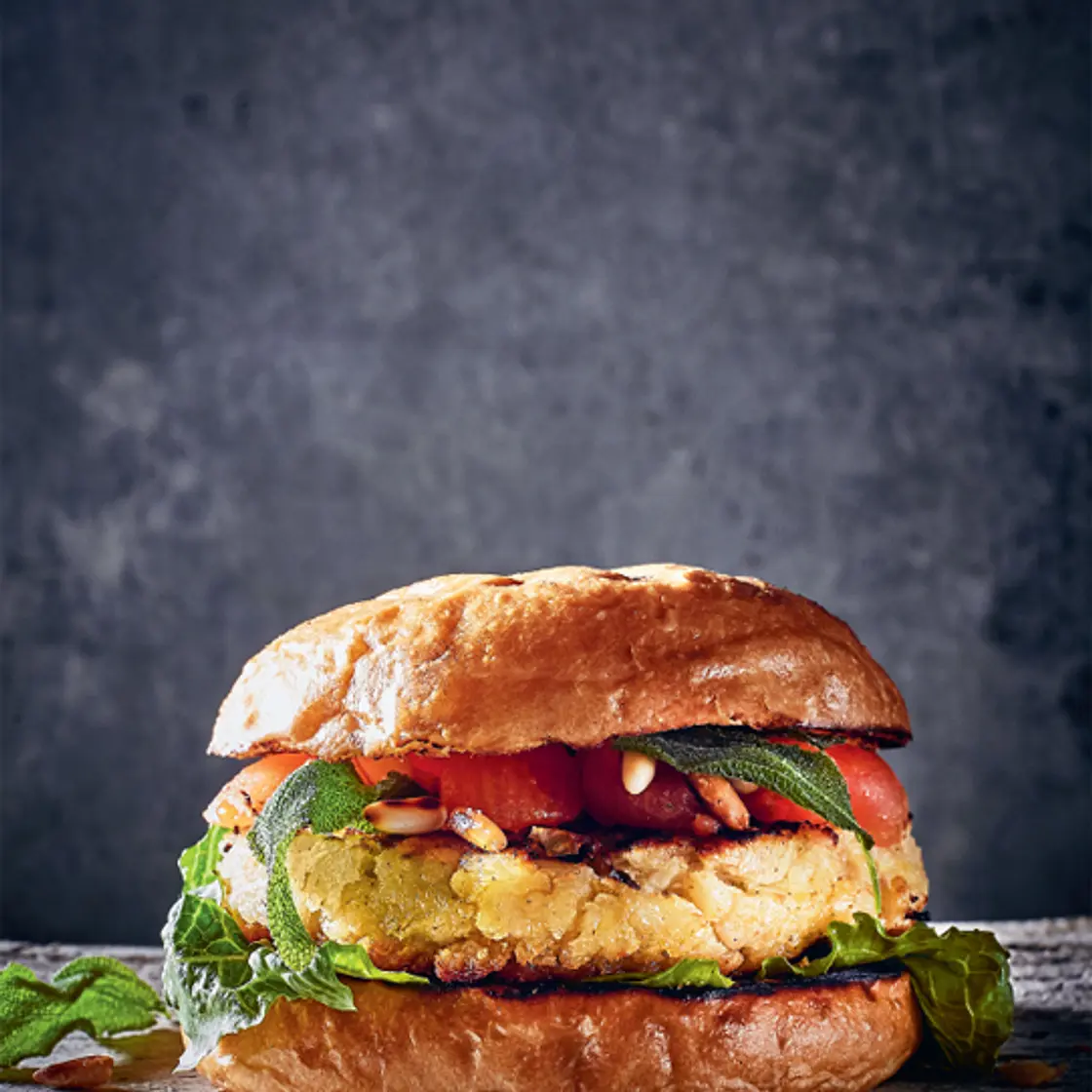 WHITE BEAN BURGER with smoked tomatoes, deep-fried sage and roasted pine nuts