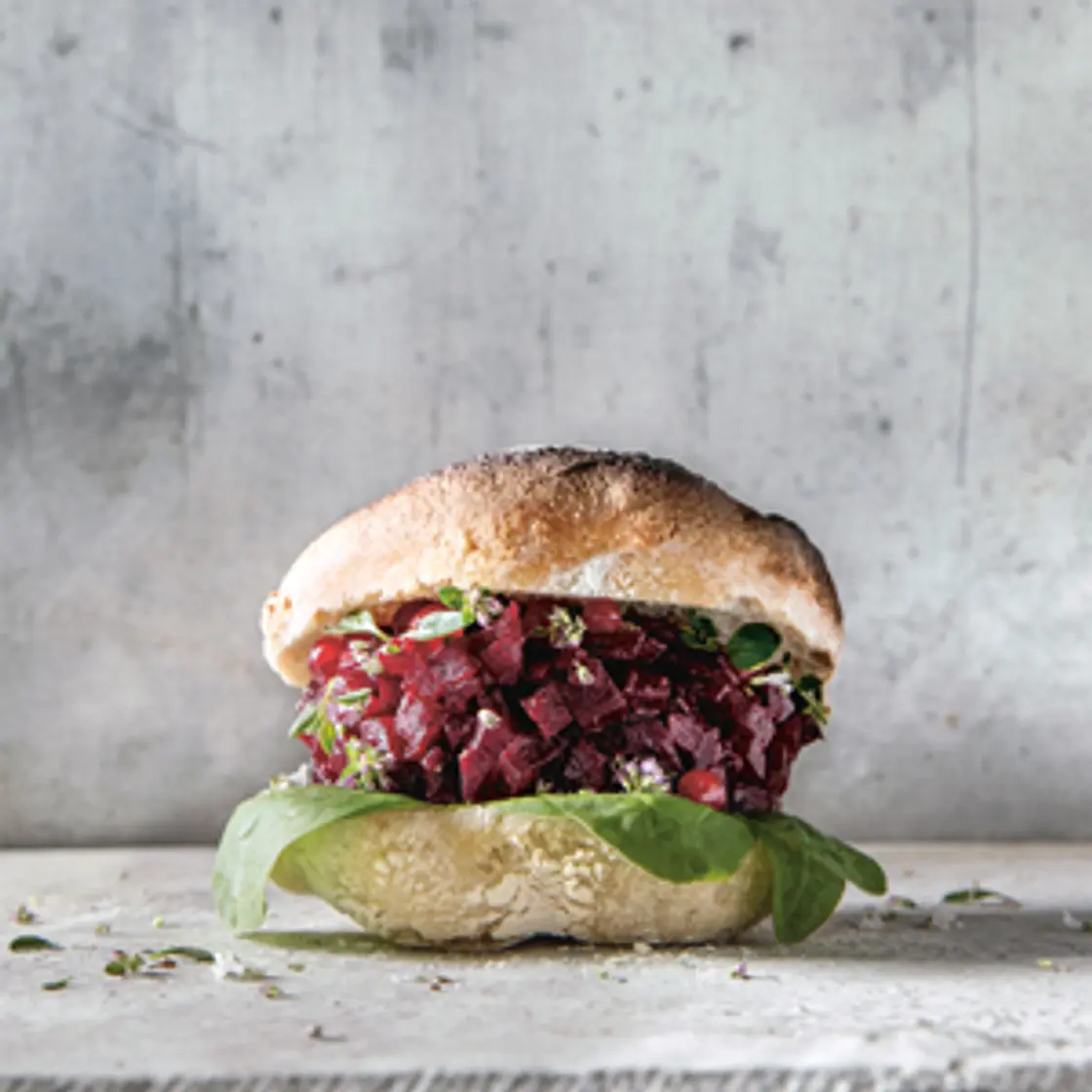 SALT-ROASTED BEETROOT BURGER WITH PICKLED REDCURRANTS AND SPINACH