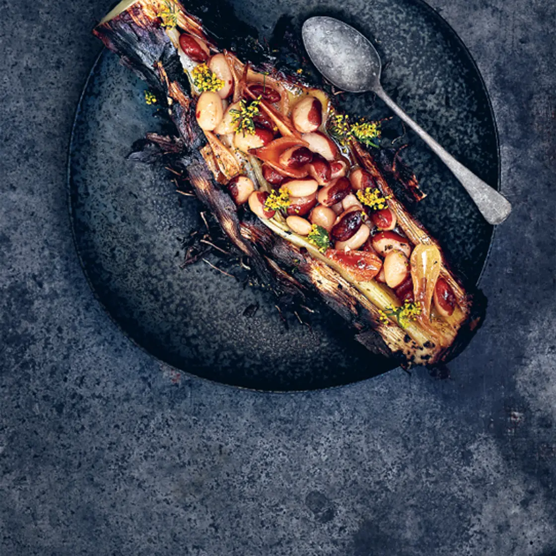 CHARCOAL-ROASTED LEEK with calypso beans, smoked onions and fennel broth