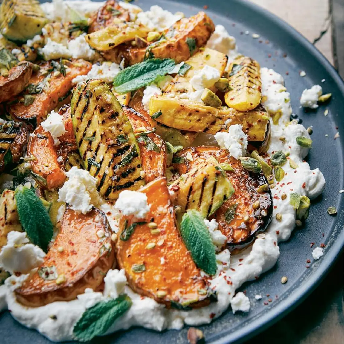 Roasted squash and zucchini with whipped feta and
pistachios