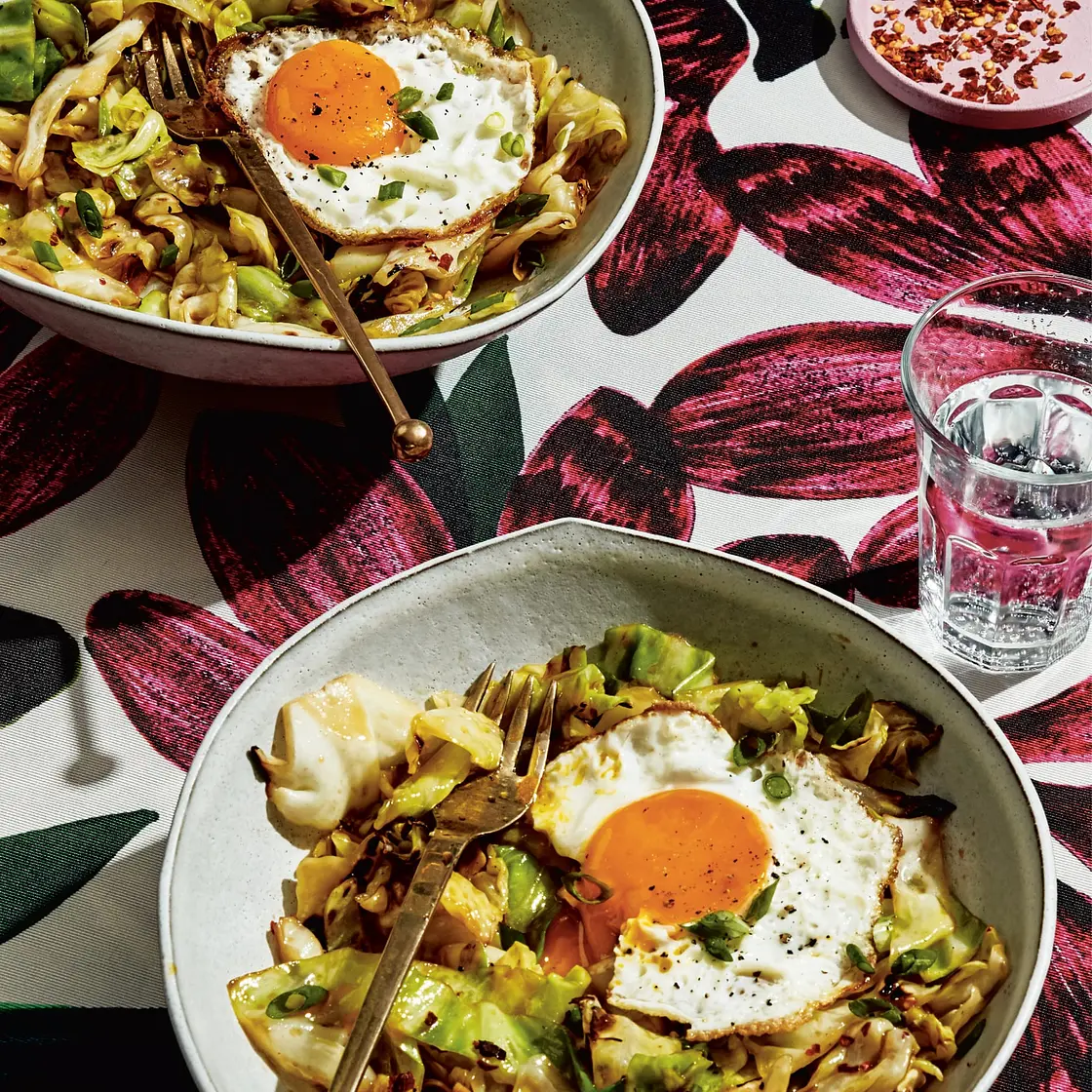 pad see ew cabbage with a runny egg