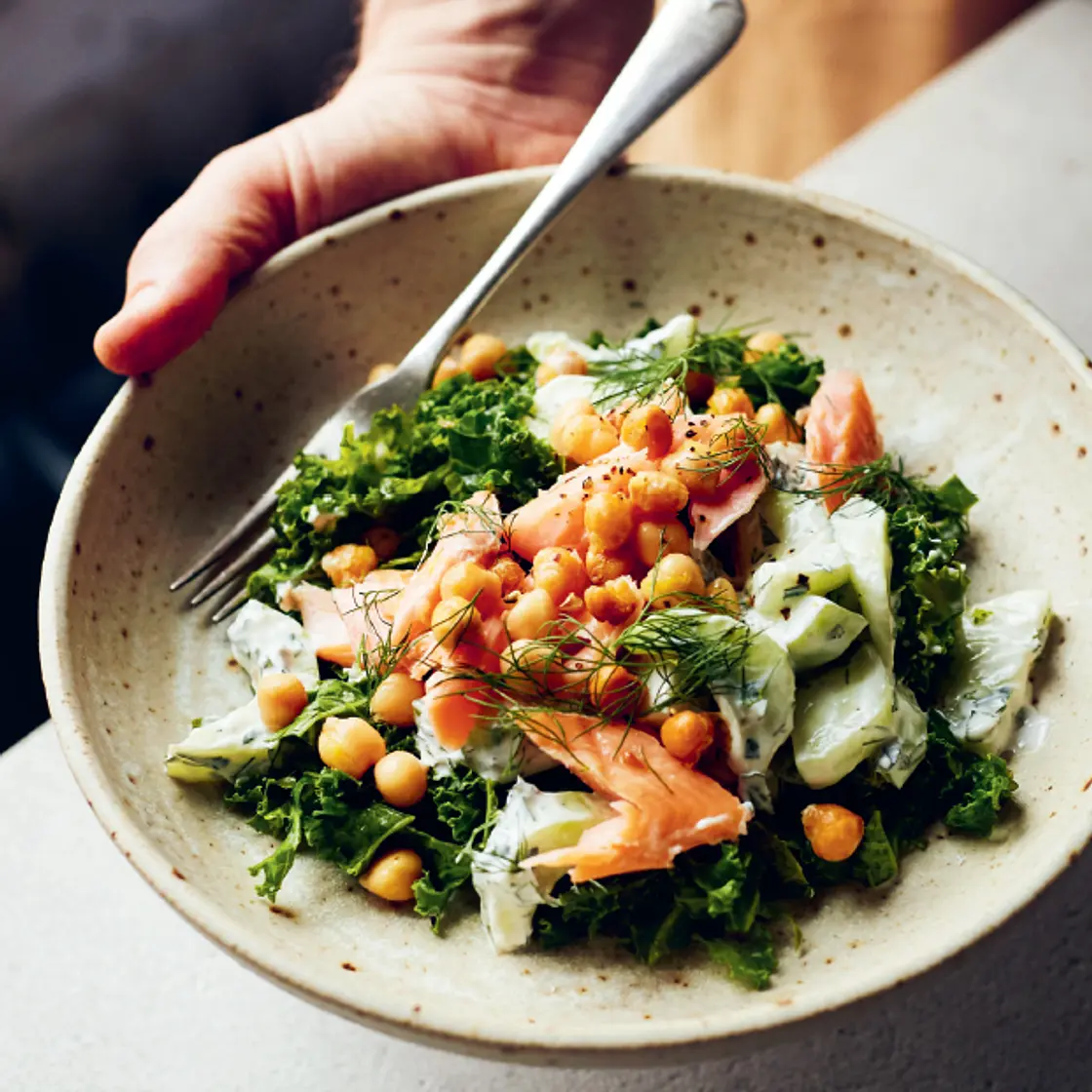 Chopped kale, dill and chickpea salad with smoked trout